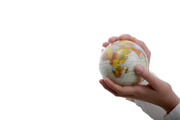 Photo cropped hands holding globe over white background