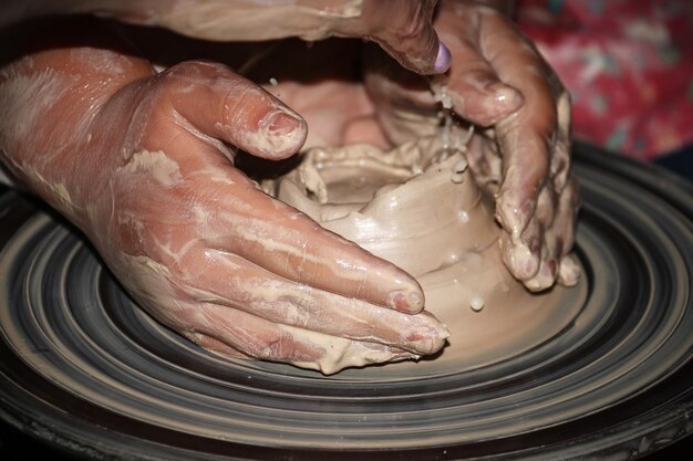 Photo cropped hands making pot