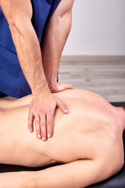 cropped hands of person massaging man