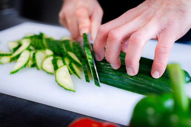 Cropped hands of person preparing food