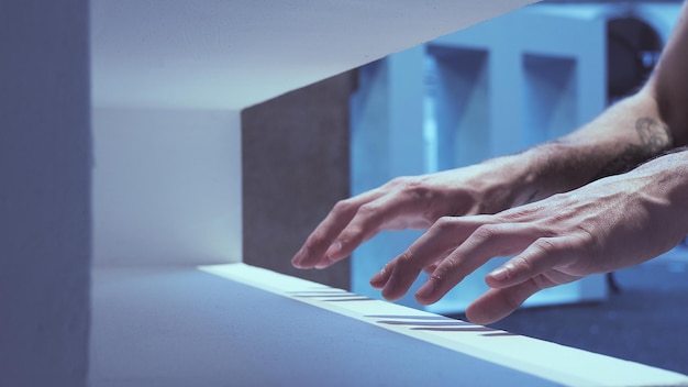 Cropped hands of person on retaining wall