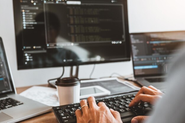 Cropped hands of person using computer