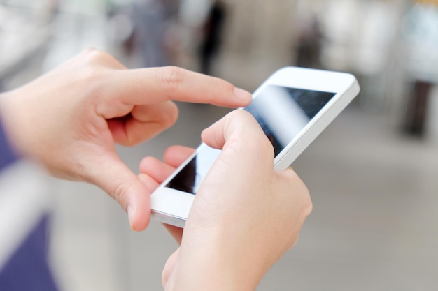 cropped hands of person using mobile phone