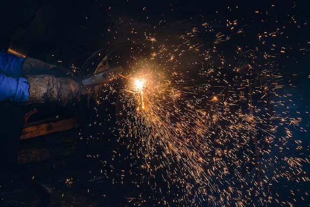 Cropped hands of person welding