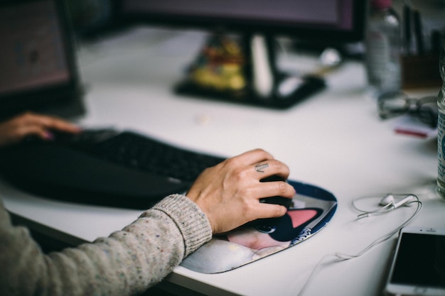 Cropped hands of person working on table