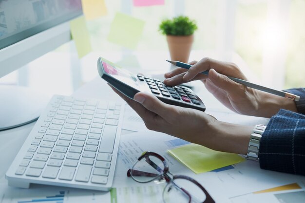 Cropped hands of person working on table