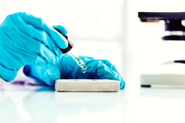 Cropped hands of scientist holding chemical