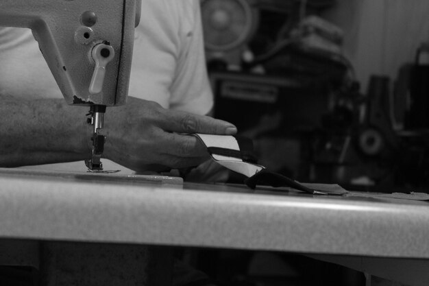 Photo cropped hands sewing machine