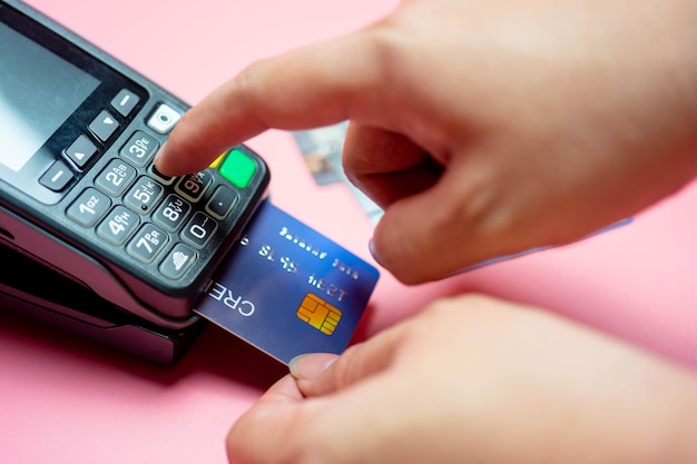 Cropped hands using credit card reader