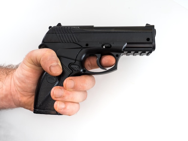 Photo cropped holding toy gun over white background