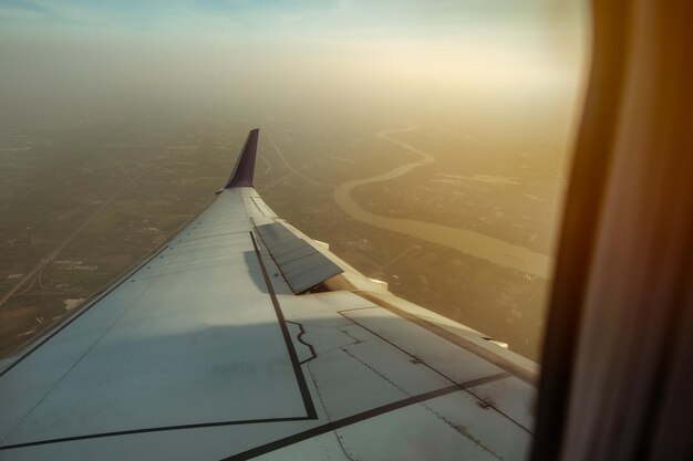 Cropped image of aircraft wing seen through airplane window