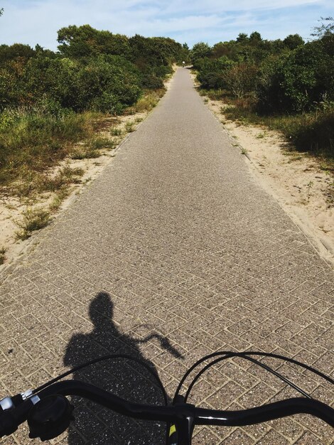 Cropped image of bicycle on road