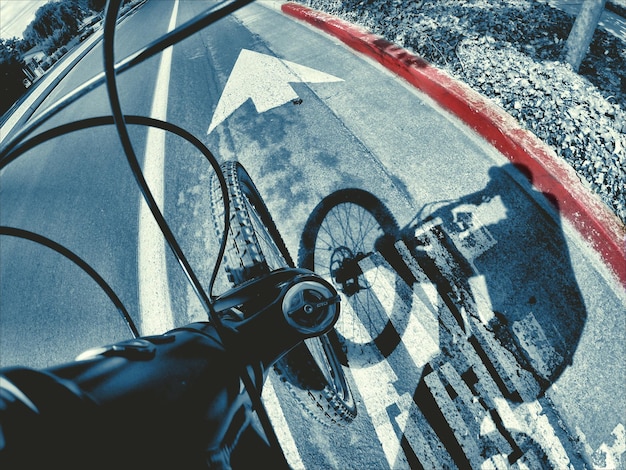 Cropped image of bicycle on street