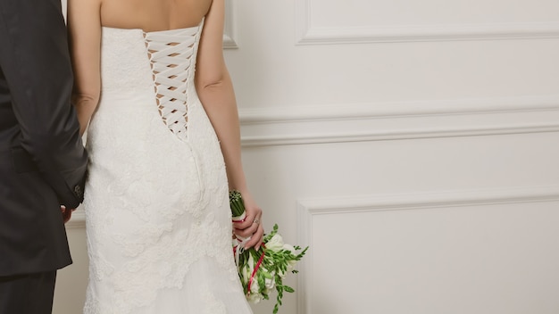 Photo cropped image of bride and groom in studio on a wedding day