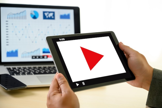 Photo cropped image of businessman holding digital tablet at office