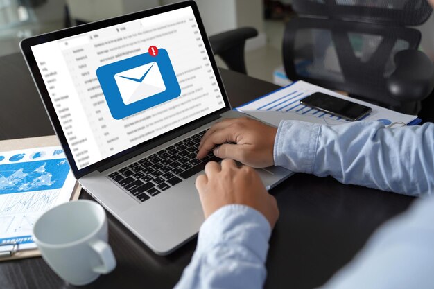 Photo cropped image of businessman using laptop at desk in office