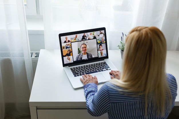 Cropped Image Of Businesswoman Using Laptop At Desk