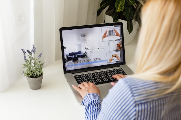 Cropped Image Of Businesswoman Using Laptop At Desk