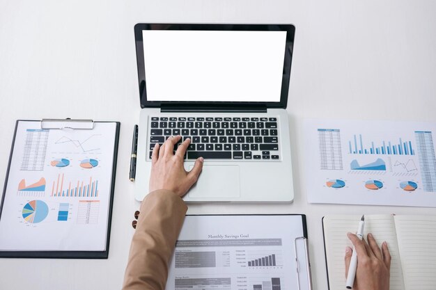 Cropped image of businesswoman working on laptop in office