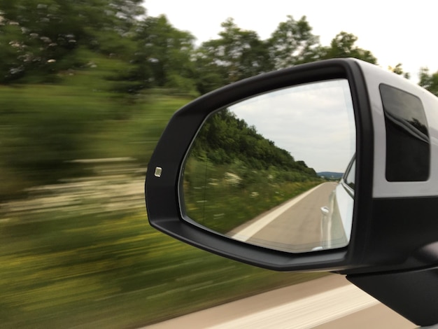 Cropped image of car on road