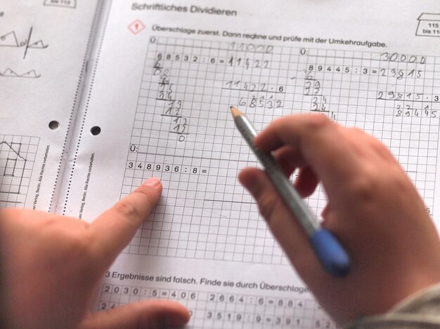 Photo cropped image of child doing homework