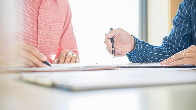 Photo cropped image of colleagues working in office