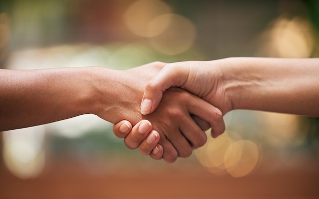 Cropped image of couple holding hands