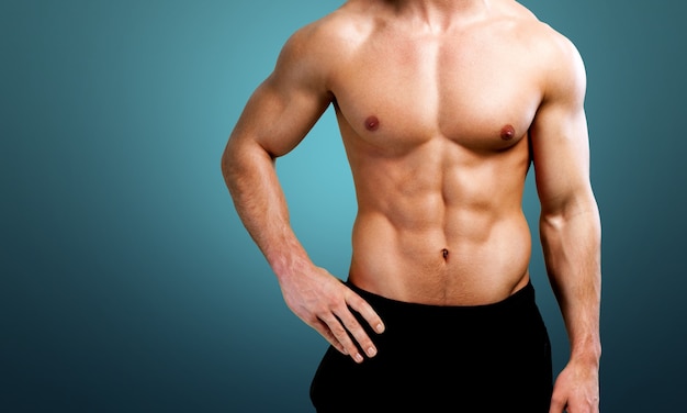 cropped image of fit muscular body of sportsman