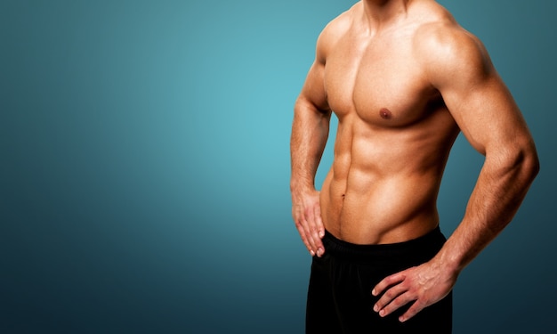 cropped image of fit muscular body of sportsman