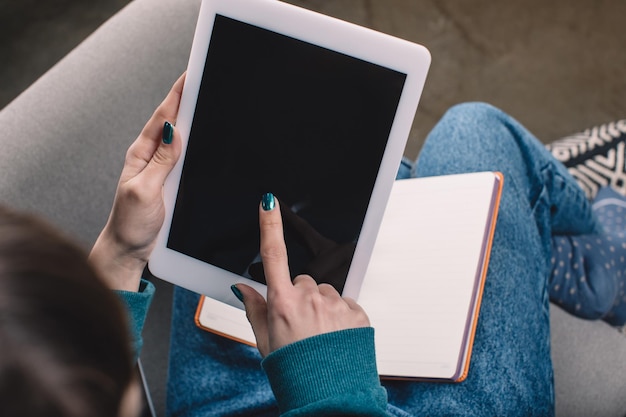 cropped image of girl using tablet