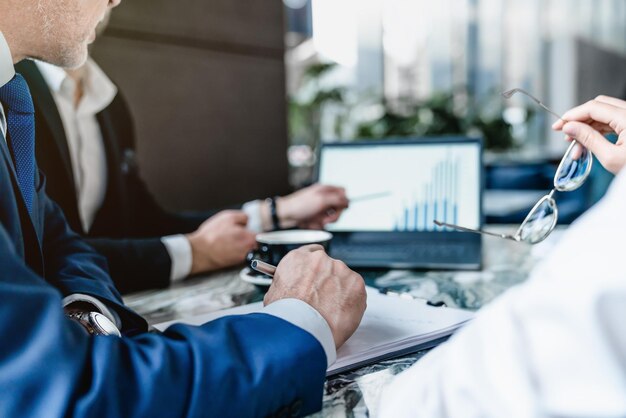 Cropped image group of business people working together in office