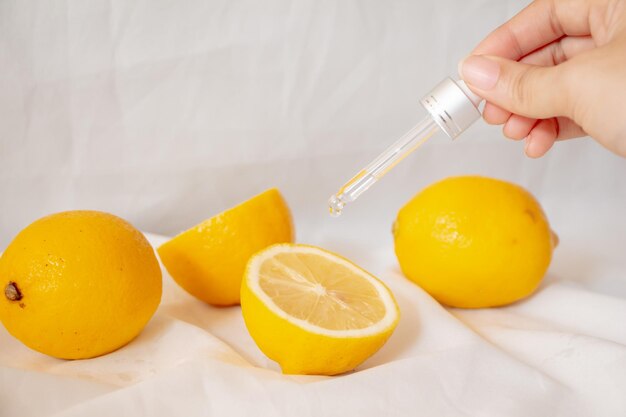 Cropped image of hand holding orange on table