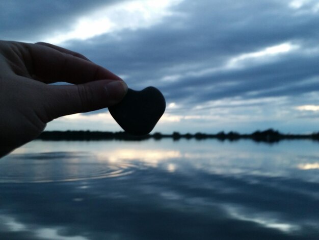 Cropped image of hand holding water