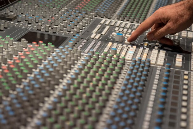 Photo cropped image of hand using sound mixer