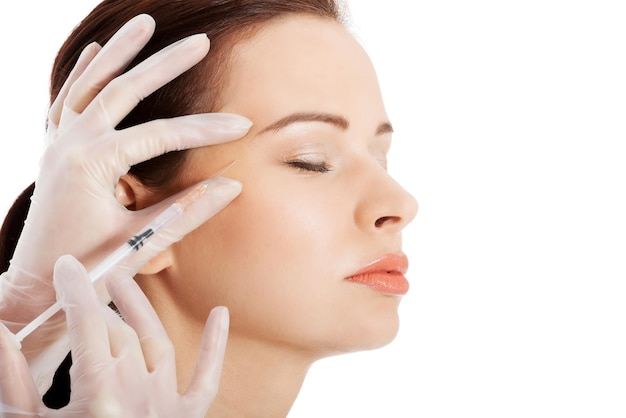 Cropped image injection botox injection to women