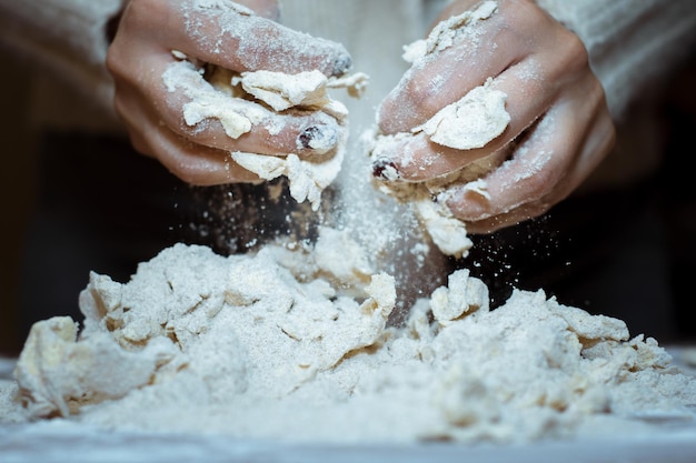 Cropped image of kneading dough