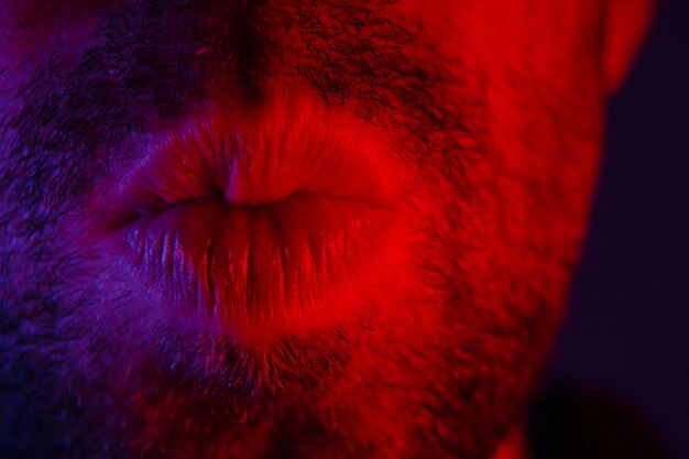 Cropped image of man puckering lips