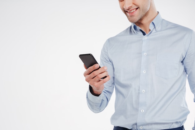 Cropped image of man using smartphone