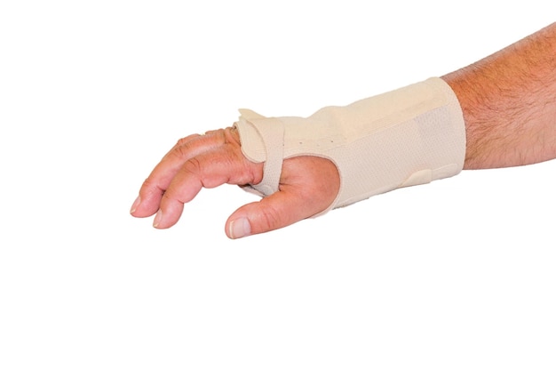 Photo cropped image of patient hand covered with bandage against white background