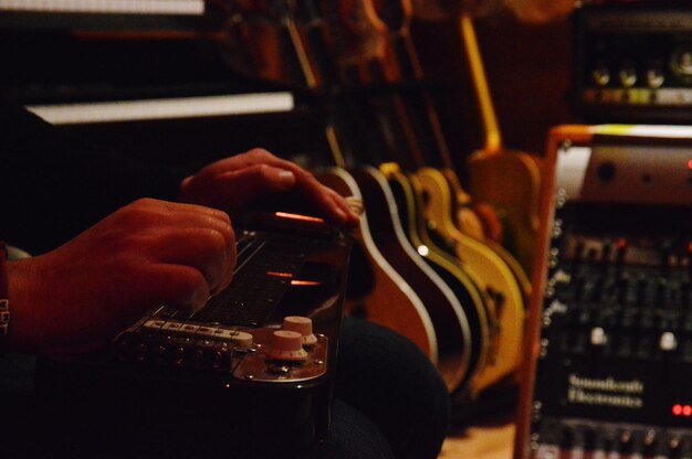 Cropped image of person playing string instrument