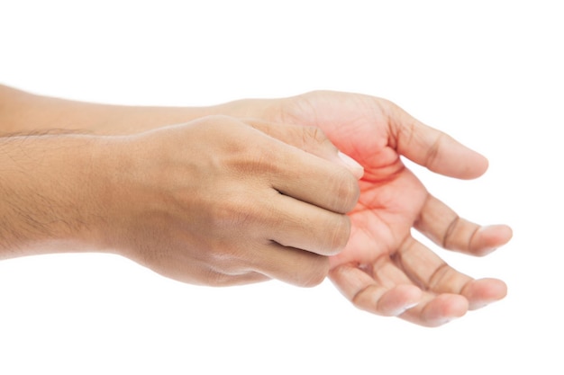 Photo cropped image of person scratching hand against white background