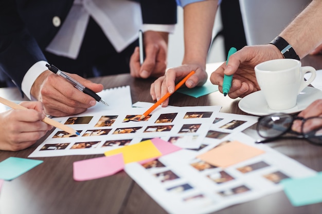 Cropped image of photo editors with documents