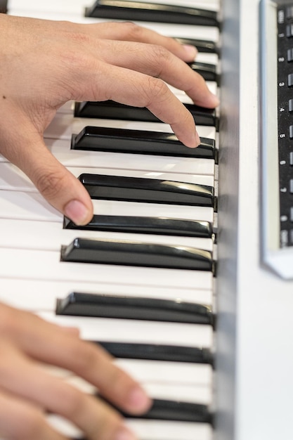 Cropped image of pianist playing piano