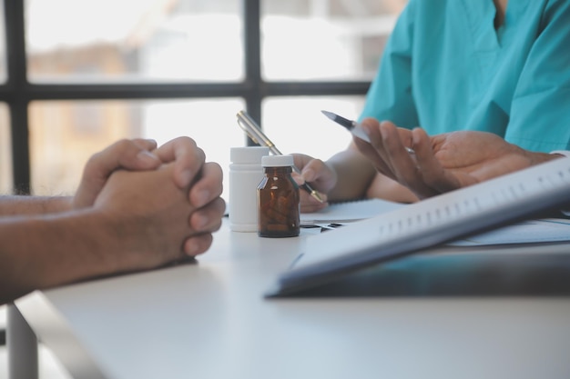 Cropped image of successful medical doctors discussing diagnosis during the conference