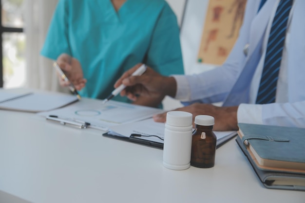 Cropped image of successful medical doctors discussing diagnosis during the conference