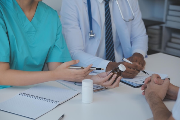 Cropped image of successful medical doctors discussing diagnosis during the conference