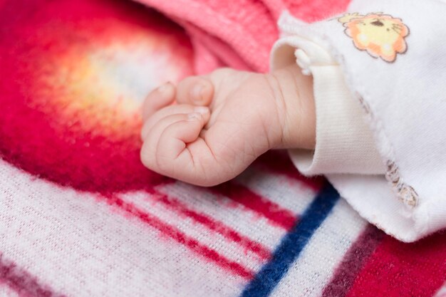 Cropped image of toddler sleeping on bed