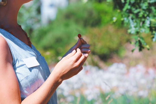 Cropped image of woman holding seed