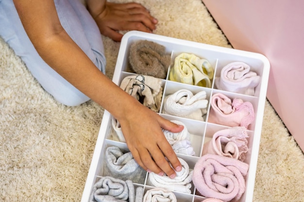 cropped image of woman organizing drawer