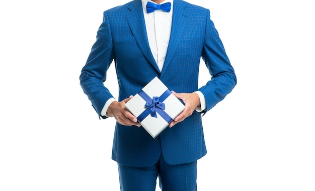 Cropped man in blue bow tie suit hold present box isolated on white